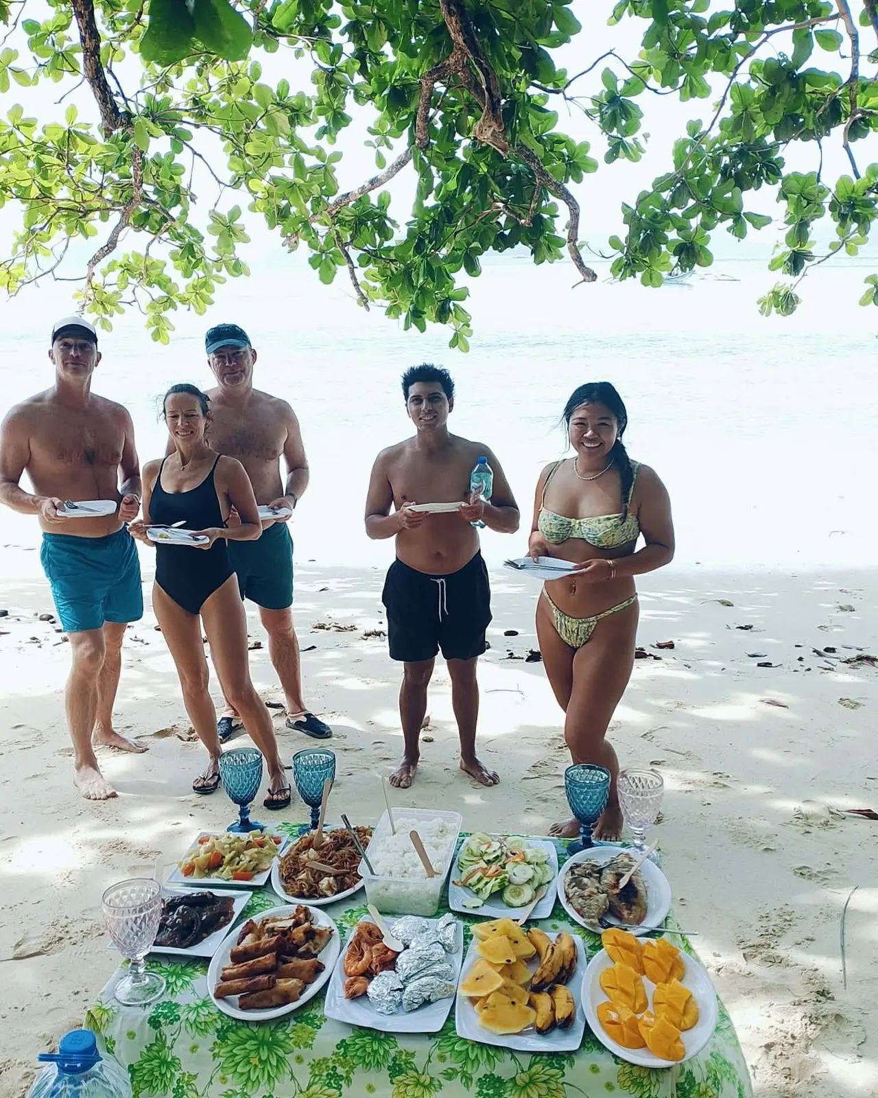A Take A Break group with their picnic lunch laid out on the sand