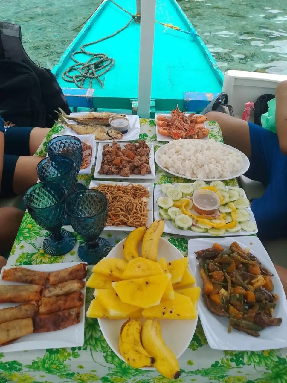 Picnic lunch on the boat: grilled fish, shrimp, crab and mango